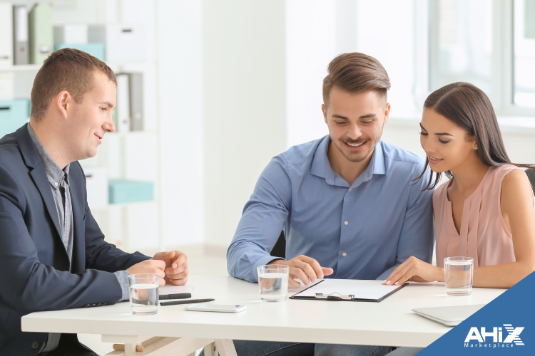Couple reviewing 2025 health insurance options with agent
